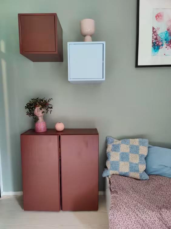bedroom with colourful cabinet
