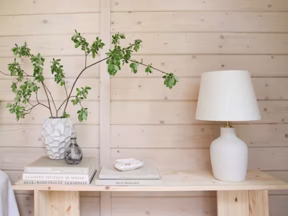 wooden log cabin painted with soothing colours