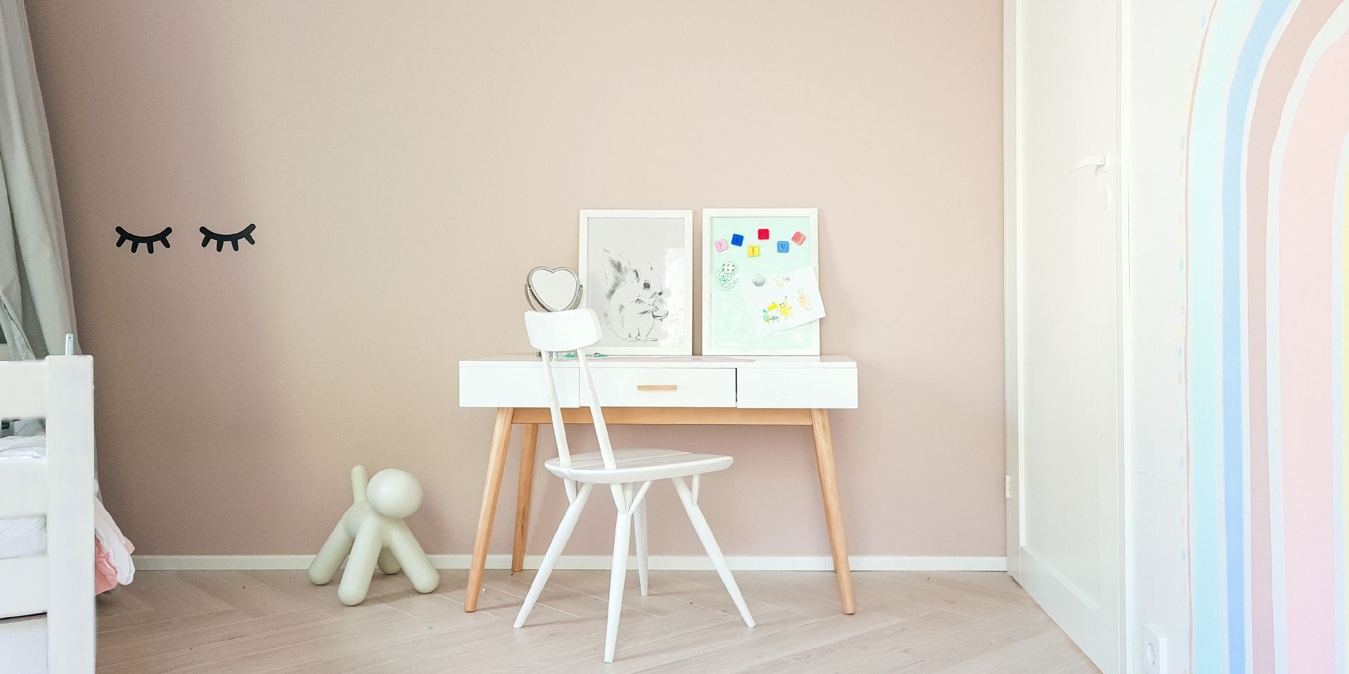 kids room with soft beige colour wall and pastel colour rainbow pattern