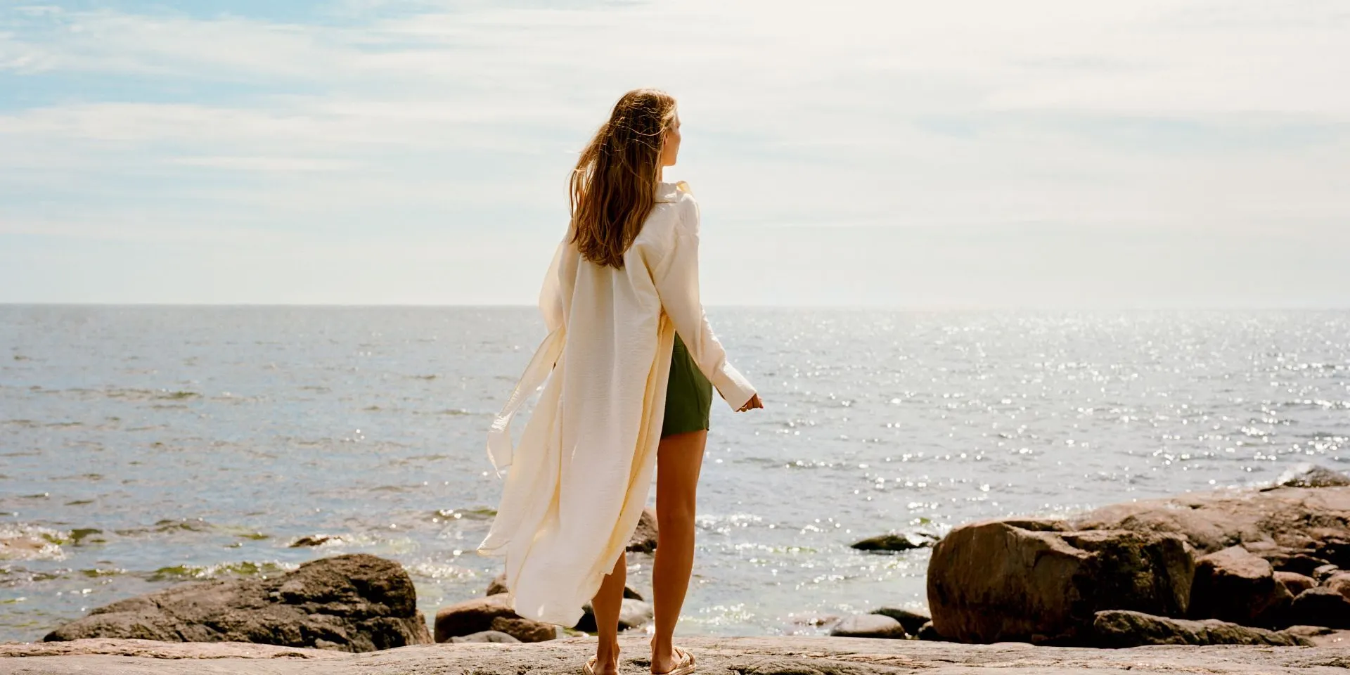 woman on rocky beach