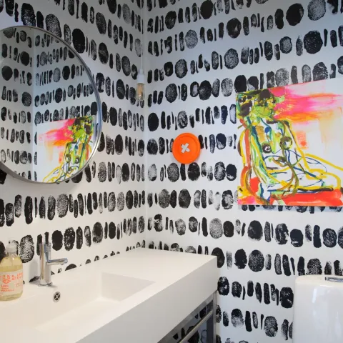 black-and-white decorative pattern on the walls of guest WC