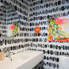 black-and-white decorative pattern on the walls of guest WC