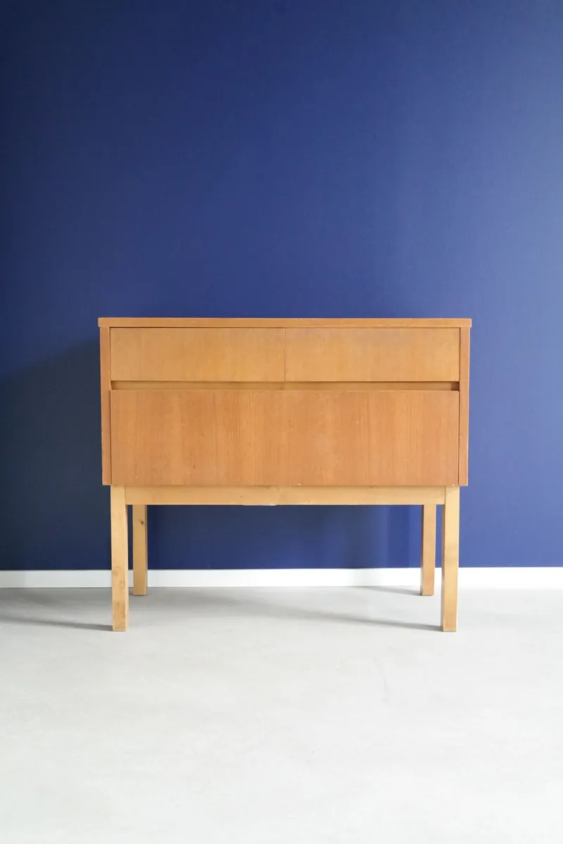 Blue bedroom with a night stand